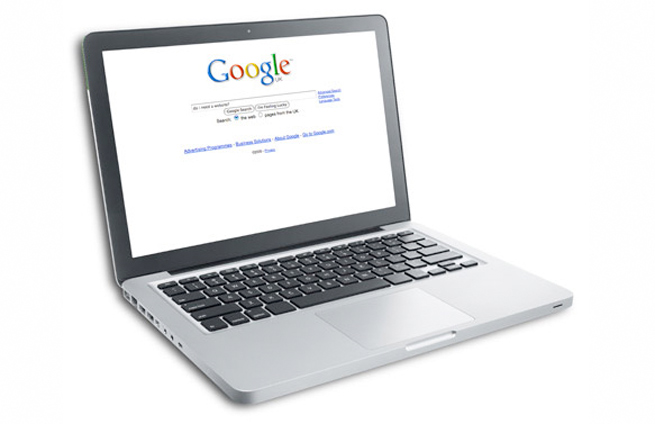 a laptop displaying the Google Search home page